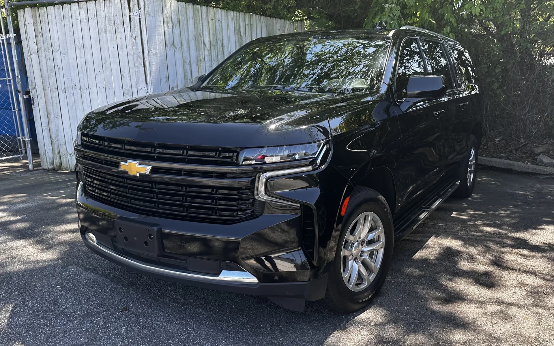 Black Chevrolet Suburban front exterior parked in shade